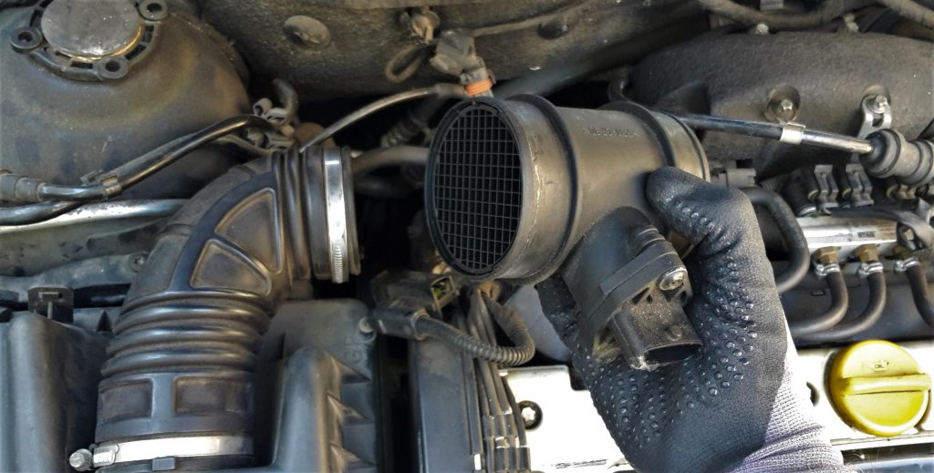 DIY car maintenance - replacing the MAF on a used car. MAF sensor dettached from the airbox pipe.