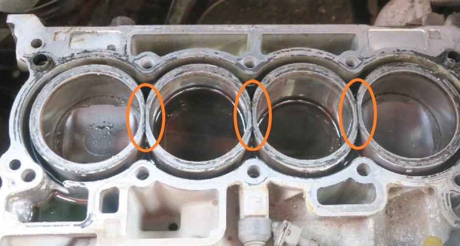 An engine block with wet cylinder liners. Areas susceptible to cracks are marked with circles.